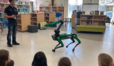 Mike and Spot the robot dog at a local school