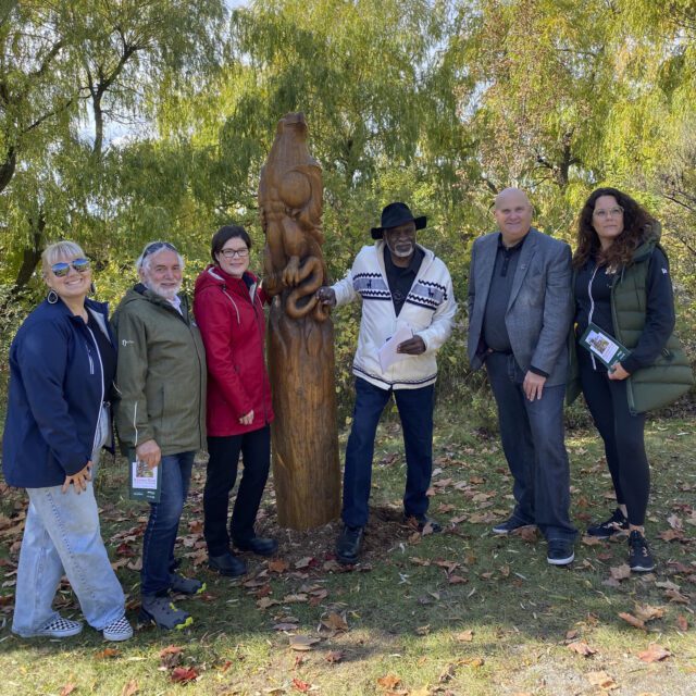 The team revealing the newly restored sculptures.