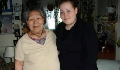 Jenna Driscoll poses with an Inuk elder who provided a lesson on traditional sewing.