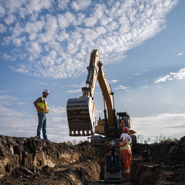 An excavator takes part in early site preparation work for the Darlington New Nuclear Project.