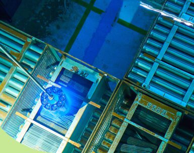 A bundle of Cobalt-60 isotopes is prepared to be loaded into a shipping flask in the irradiated fuel bay at Pickering Nuclear Generating Station.