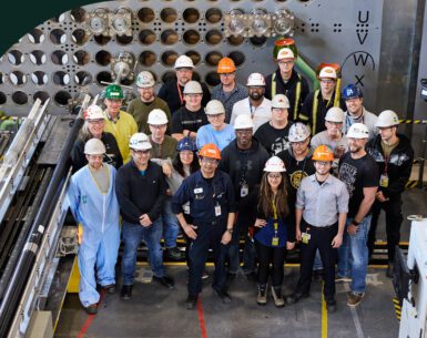 A diverse group of employees at the Darlington Nuclear mock-up and training facility.