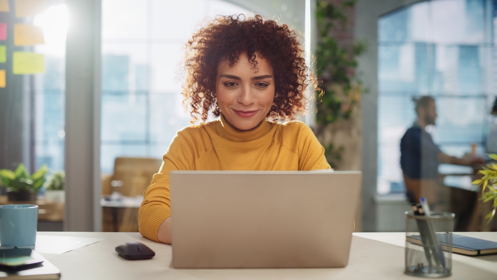 Woman applying for Power for Change grant on computer