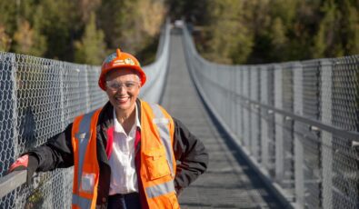 Gillian MacLeod, Senior Environment Specialist with OPG, poses on a suspension bridge near OPG's Ranney Falls Generating Station.