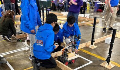 Students work on their robot during the robotics contest at the 2024 Skills Ontario Competition.