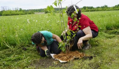 Providing a helping hand for the May 25 tree planting were members of the local Scouts group.