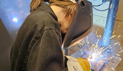 A student gets hands-on with a welding demonstration at the Mind Over Metal camp.