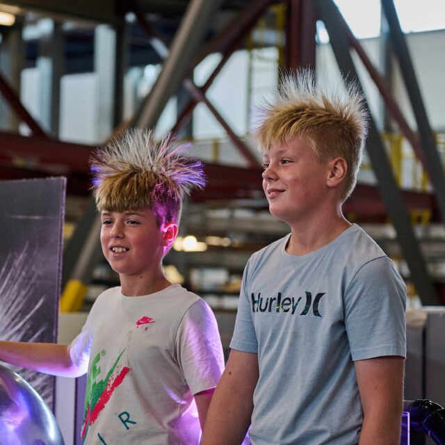 Members from the community get a hair-raising demonstration on static electricity at OPG's Community Power Expo held on Sept. 14, 2024.