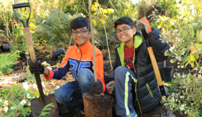 Community members take part in a tree planting session. OPG is celebrating the planting of more than 10 million trees and shrubs since 2000.