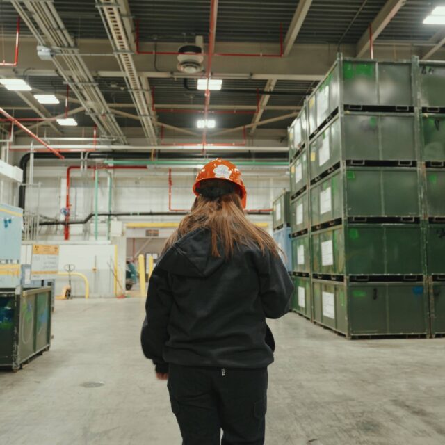 Employee walking through nuclear waste management facility