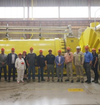 Visitors and OPG employees pose for a photo at the Atikokan Generating Station during its 40th anniversary celebration event.