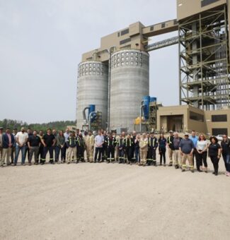 Visitors and OPG employees pose for a photo at the Atikokan Generating Station during its 40th anniversary celebration event.
