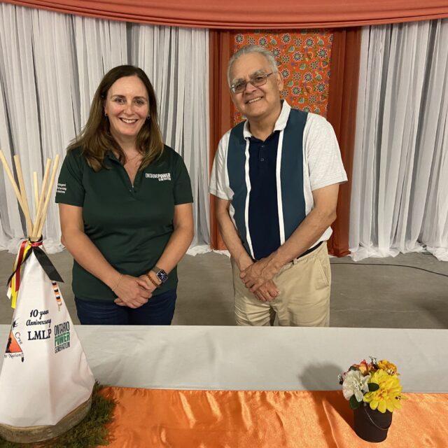 OPG's President and CEO, Nicolle Butcher, stands with Moose Cree First Nation Chief, Peter Wesley, during a celebration event to mark 10 years of partnership on the Lower Mattagami hydro complex.