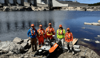 OPG workers pose with the Otter uncrewed surface vessel.