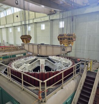 The new rotor is lifted and installed at Otto Holden Generating Station's Unit 6.