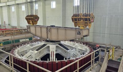 The new rotor is lifted and installed at Otto Holden Generating Station's Unit 6.
