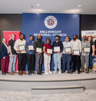 Eight new graduates of the Introduction to Millwrighting training program were all smiles during a celebration event at OPG’s Darlington Energy Complex in February.