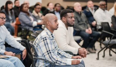 Graduates of the Introduction to Millwrighting program listen to a speaker at the Darlington Energy Complex.