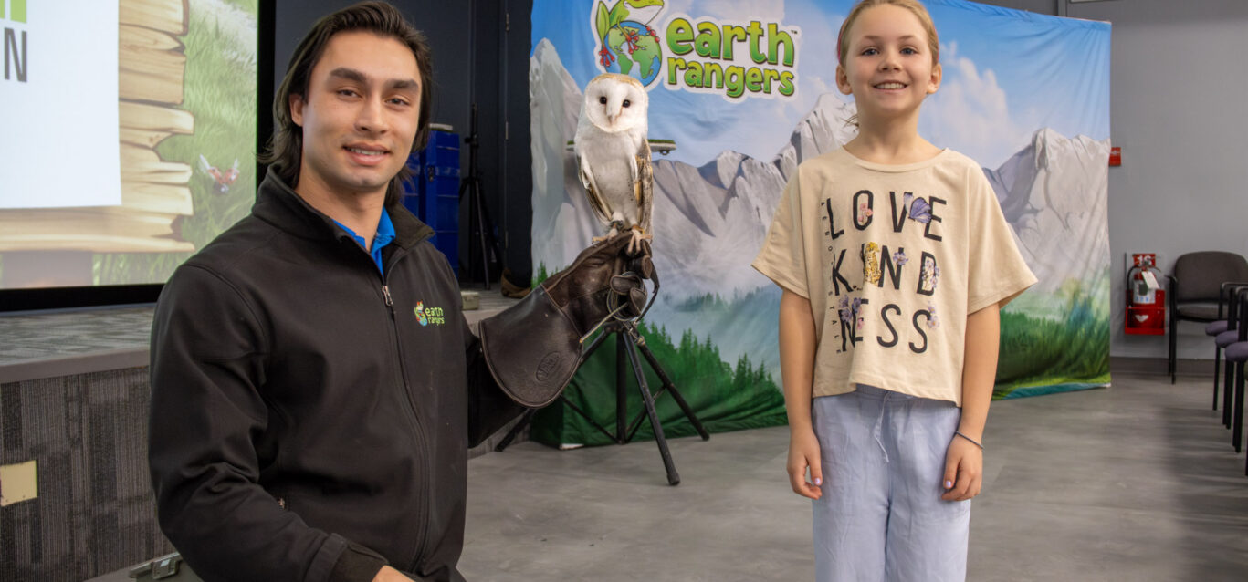 A child attends an OPG community event with partner Earth Rangers