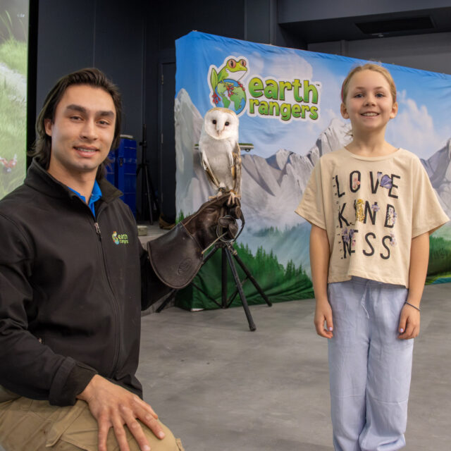 A child attends an OPG community event with partner Earth Rangers