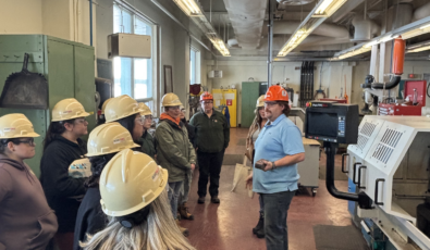 Students with the Women in Trades program listen to an OPG employee during a tour of R.H. Saunders GS.