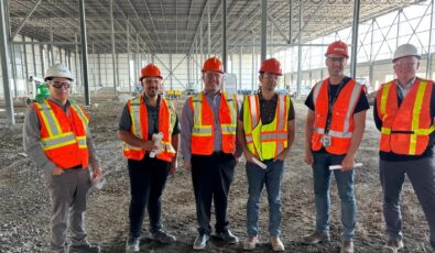 OPG employees stand at the site before construction began.
