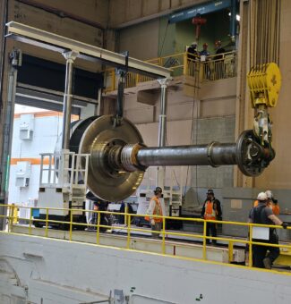 A new runner and shaft assembly arrives at OPG's Sir Adam Beck I hydro station in Niagara.