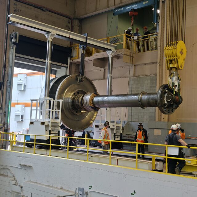 A new runner and shaft assembly arrives at OPG's Sir Adam Beck I hydro station in Niagara.