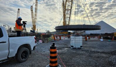 The massive Basemat component, which will serve as the foundation for the G7's first SMR, is lifted at the Darlington New Nuclear Project site.