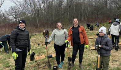 Members of the community take part in a tree-planting event at Pickering.