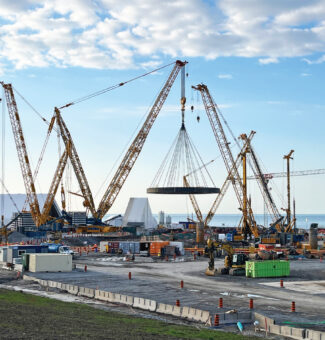 Weighing over two million pounds, the basemat is precisely lowered into the reactor shaft at the Darlington New Nuclear site